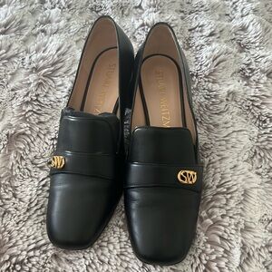 Black loafer heels with gold detail